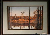 Framed fine art print titled 'Evening Flight' by Mr. Binks showing a reflective lake, trees with autumn foliage, and birds in flight under a clear sky.