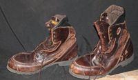 Photo of a pair of brown Red Wing hiking boots with visible wear and intact structure.