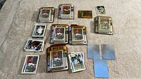 Overview of all soccer trading cards laid out on a surface, multiple Upper Deck branded cards and other cards visible, showing player images and stats, some cards laid in piles.