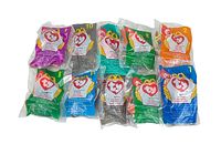 Image showing 10 sealed McDonald's Ty Teenie Beanie Babies plush toys arranged side by side, displaying the Ty heart logo and promotional packaging with various character numbers and colors.