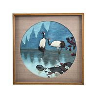 Front view of framed art piece showing two cranes made with real feathers against a painted backdrop.