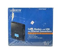 Front view of sealed Linksys CM100 cable modem box showing product image, Linksys and Cisco branding, and key features.