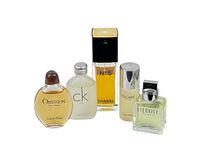 Five designer perfume/cologne bottles together showing brand names and sizes, mostly travel sizes.