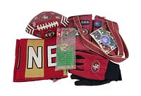 Full lot of San Francisco 49ers fan items: scarf, football, gloves, lunch bag, and light switch cover