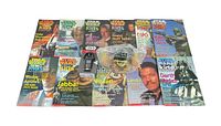 Overview of the Star Wars Kids magazines and collectibles laid out showing character covers and items included in lot.
