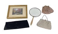 Complete view of framed print, three vintage purses, and handheld mirror on white background