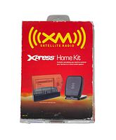 Front view of the XM Satellite Radio Xpress Home Kit boxed, showing the red front panel with product images and branding.