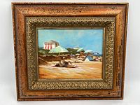 Frontal view of the entire framed oil on panel painting showing the beach scene with umbrellas and beach hut.