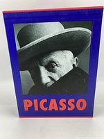 Front view of the slipcase holding two Picasso art books, featuring a black and white photo of Picasso and the title in bold red text.