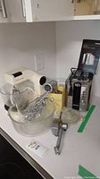 Full lot including toaster, mixer, utensil holder, and citrus juicer on countertop