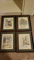 Four framed pen and ink drawings by Patrick du Moulin, displayed on carpet floor showing size and framing style