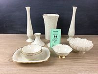 Full lot view showing all items including candlesticks, vases, bowls, and rectangular dish on a wooden surface