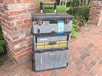Front view of the stacked tool chest showing three compartments, metal and plastic construction, and clear organizer drawer in the middle.