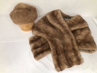 Mink fur shawl and mink fur hat shown together on white background for scale and condition display.