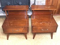 Pair of vintage wooden end tables shown side by side, showing overall design and size.