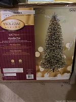 Original packaging box showing Holiday Living branding and Klondike Pine model details