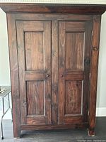 Front view of closed double-door armoire