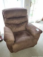Front view of brown recliner showing overall condition and tags