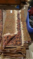 Full view of folded rug showing overall pattern and edges