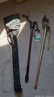 Wide view showing ceremonial sword, both scabbards, and carrying case laid out