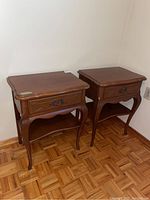 Pair of nightstands in corner view showing both units