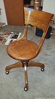 Front perspective view showing seat, backrest, and caster wheels