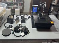 Main unit and all attachments laid out on table