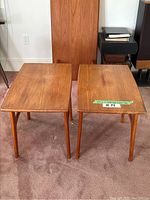 Pair of teak side tables, front view