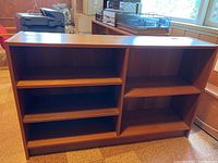 Front view of the wooden MCM style shelf with multiple compartments for storage or entertainment use.