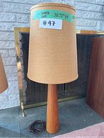 Full view of lamp showing teak base, shade and cord