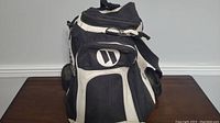 Front view showing zippered main compartment, front pocket, and Worth logo on front pocket.