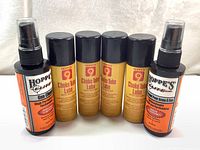 Six bottles consisting of 2 Hoppe's Elite firearm cleaner and 4 Hoppe's 9 Choke Tube Lube bottles with Teflon.
