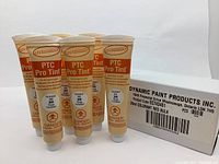 Six tubes of Dynamic PTC Pro Tint paint colorant in Permanent Red 346 with a white cardboard box labeled Dynamic Paint Products Inc.