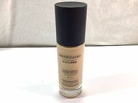 Full front view of the liquid foundation bottle showing brand name and product line as Bare Minerals Bare Pro.