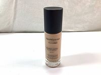 Front view of the Bare Minerals Bare Pro Liquid Foundation bottle, showcasing the product name and basic details on the label.
