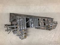 Top and side views of the 3D metal barn wall art showing its construction and rustic metal finish.