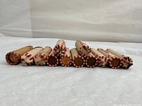 Front view of paper-wrapped penny rolls stacked in two rows