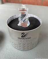 Front view of Swarovski crystal shepherd figurine in original box with foam.