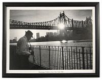 Framed black and white photograph showing musician playing clarinet with Queensborough Bridge and New York city skyline in sunrise background.