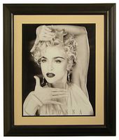 Framed black and white reproduction photo of Madonna from Vogue music video. Image double matted and glass mounted in black frame.