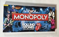 Photo of the Monopoly The Rolling Stones Collector's Edition game box showing band members, logo, and artwork.