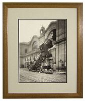 Framed black and white reproduction photograph of the 1895 train accident at Gare Montparnasse.