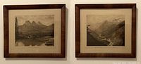 Two vintage black and white photographs of Canadian Rockies in wooden frames with mats and glass, showing The Three Sisters and Mt Abbott valley landscape scenes.