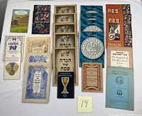 Collection of all Passover booklets laid out on a surface, showing covers and quantity.