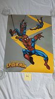 Full view of vintage 1988 Marvel The Amazing Spider-Man poster showing three Spider-Man figures swinging on webs against a gray and yellow background.