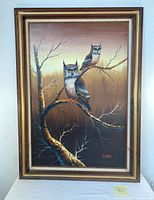 Full view of framed oil painting featuring two owls perched on bare tree branches with a brown gradient background.