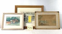 Three framed landscape watercolor paintings arranged side by side showing various lakeside scenes and architectural elements