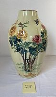 Front view of tall vintage Ardalt ceramic vase showing hand-painted flowers and butterflies on cream background