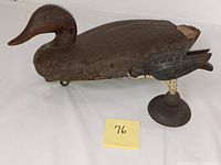 Wooden duck decoy and small bird figurine together, showing size and presence of both items in lot
