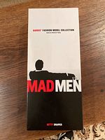 Closed box showing Mad Men branding and Betty Draper label